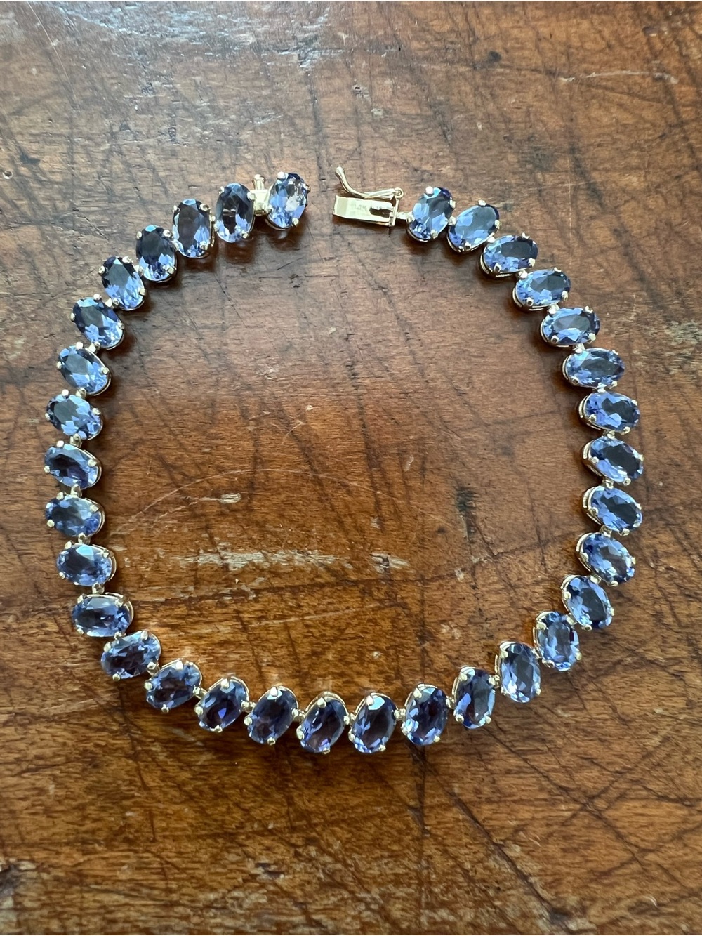 Mark Anthony Jewelers Gold Tennis Bracelet with Oval Tanzanite Stones - 7”